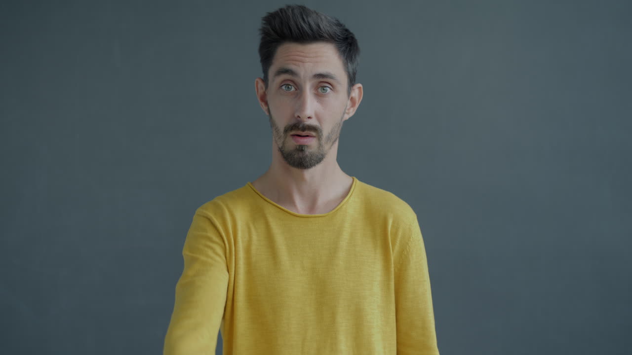 Man with a surprised and pointing expression