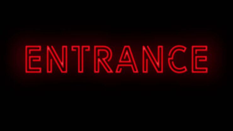 Flashing red ENTRANCE neon sign on and off with flicker