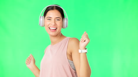 headphones, dance and face of happy woman on green