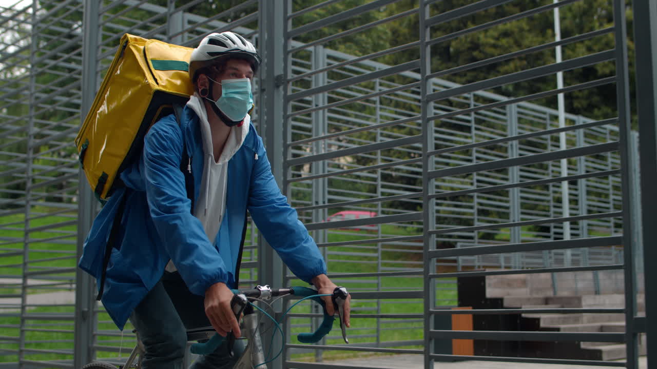 Delivery cyclist with mask