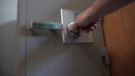 old grey safe opened with combinations to reveal metal boxes inside