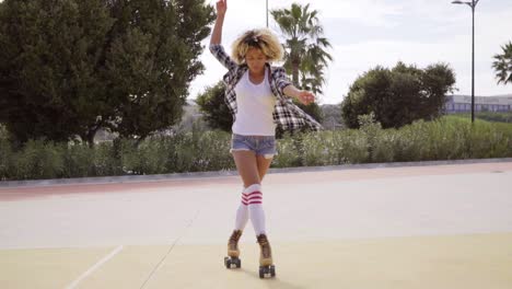 pretty young woman practising her roller skating