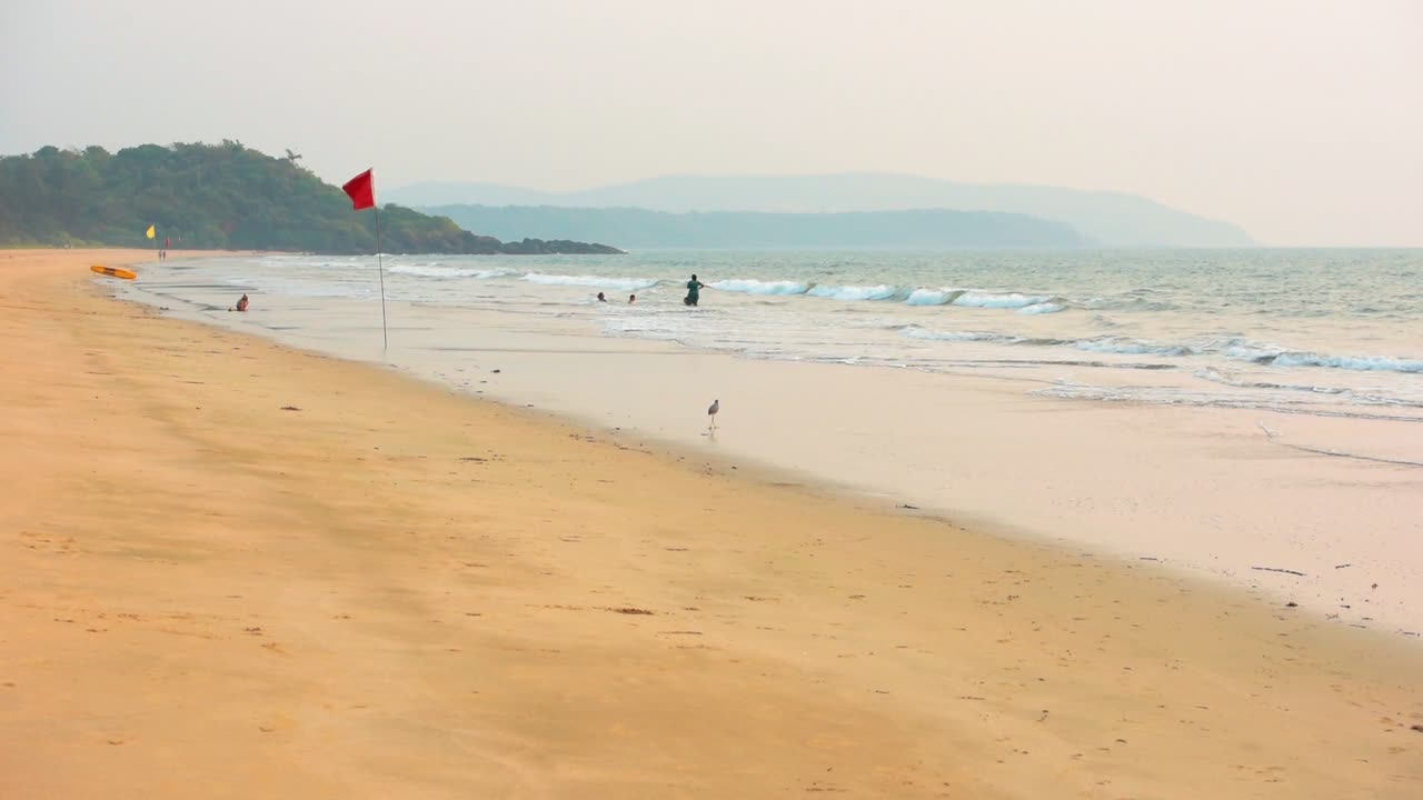 The Beautiful White Sand Beach In Galgibaga, India With Calm Sea and Cloudy Sky Above - Perfect for Summer Vacation - Wide Shot