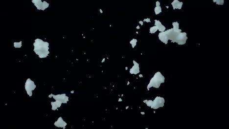 snow flying in the air in slow-motion, black background, 120fps #2