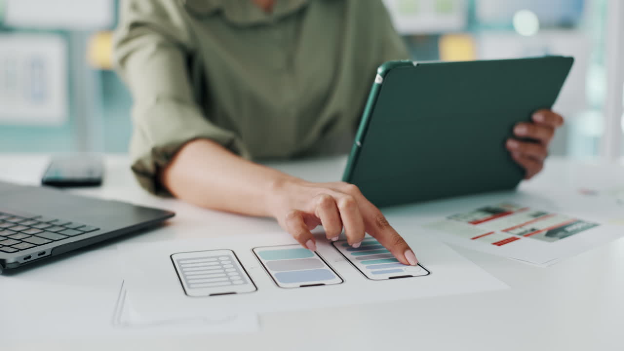UI/UX design planning on a tablet and laptop