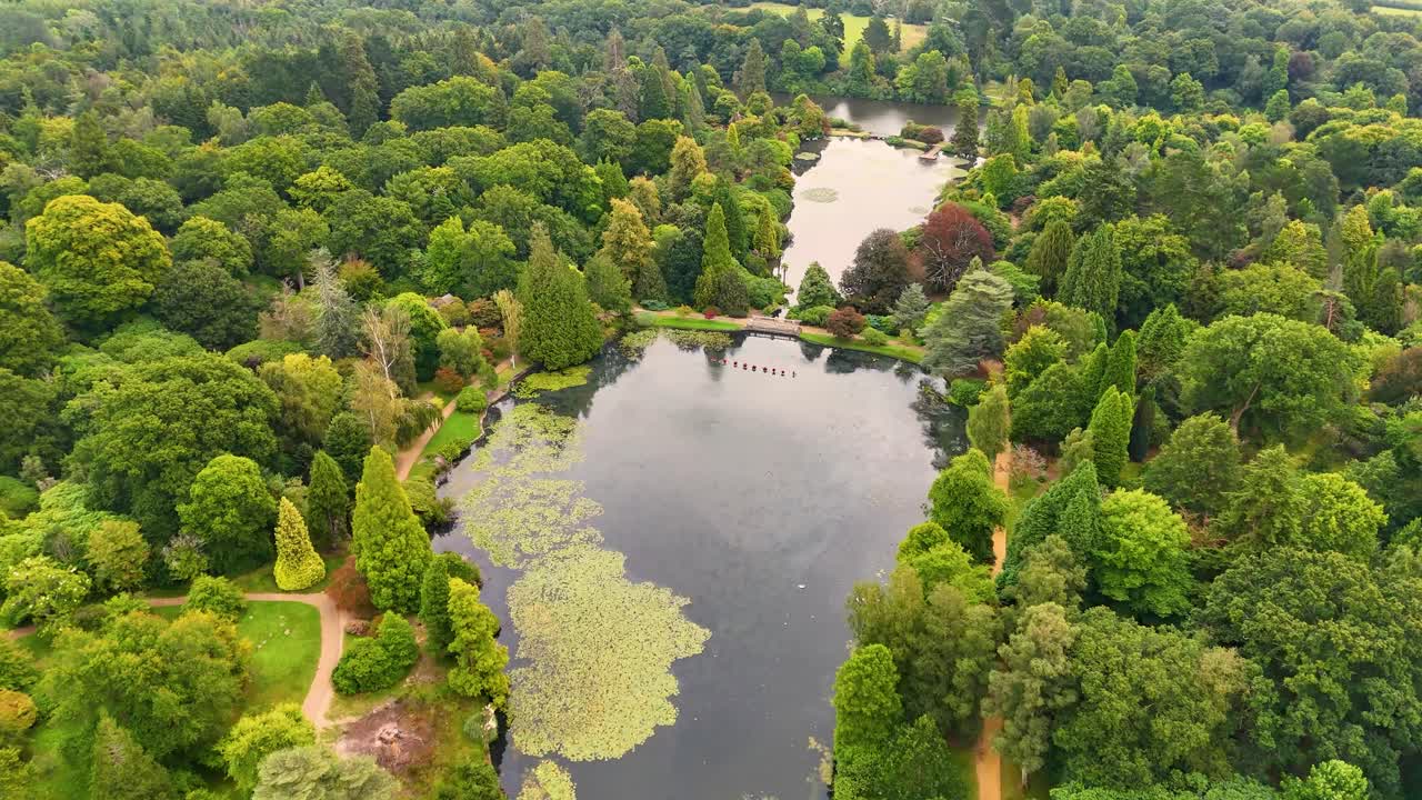 Beautiful aerial drone footage capturing the picturesque parks and gardens of Sussex, England, highlighting their lush beauty and tranquil charm from above
