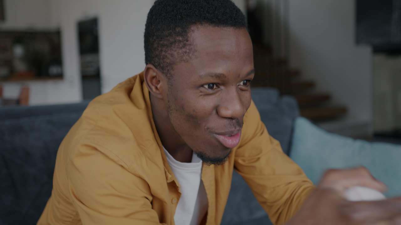 Man Excitedly Watching a Game
