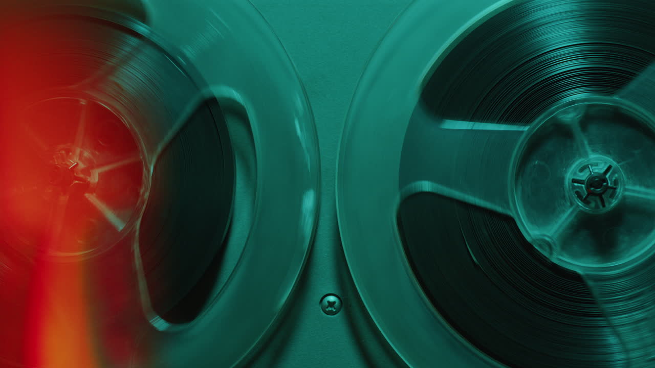 Retro-Styled Open Reel Tape Recorder Playing Music in Neon Light