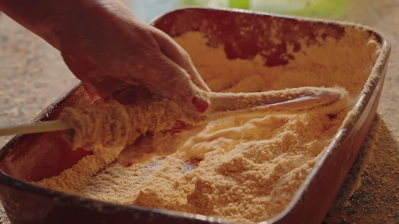 Pig tripe being rubbed with cornmeal during traditional cleaning process in northern Portugal