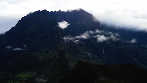 Drone-footage-passing-by-a-crest-with-the-Piton-des-Neiges