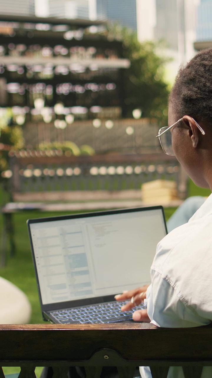 Vertical Video Woman young adult working on binary code programming with laptop screen