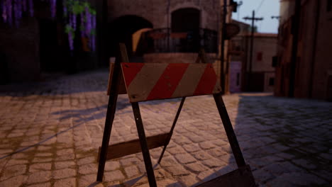 road closed sign in a cobblestone street of an old town