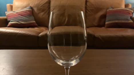 red wine slowly poured into glass