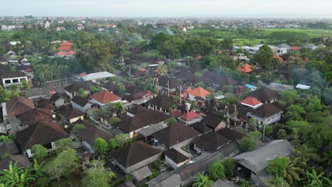 Balinese-roads-lined-with-houses-and-festive-decoration,-aerial