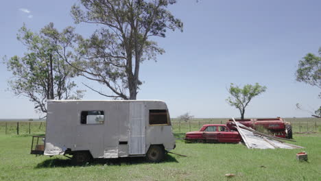 Sunny-day,-abandoned-cars-on-roadside-near-Saladas,-Argentina