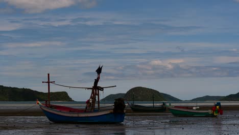 fishing boats mooring in low tide are usually seen as part of a romantic provincial seascape of khao sam roi yot national park, prachuap khiri khan, in thailand