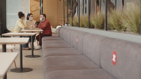 diverse companions sitting at cafe table