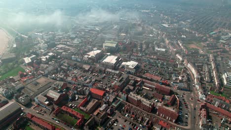 Scarborough-North-bay-coastal-town-aerial-view-above-clouds-looking-down-to-rooftops-Yorkshire