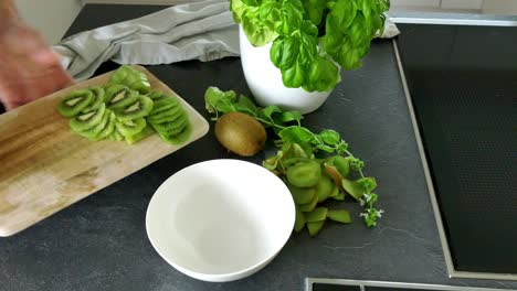 cut slice healthy vegan kiwi fruit to get vitamins