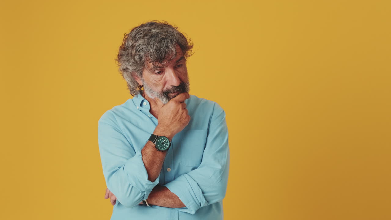Middle-Aged Man Thinking and Shrugging with Doubt