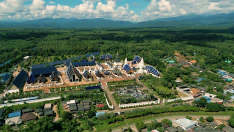 4K-Cinematic-nature-aerial-drone-footage-of-the-beautiful-temple-of-Wat-Ban-Den-next-to-Chiang-Mai,-Thailand-on-a-sunny-day