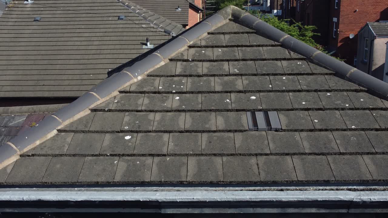 Rooftop inspection aerial view inspecting damage and insurance of real estate for homeowner