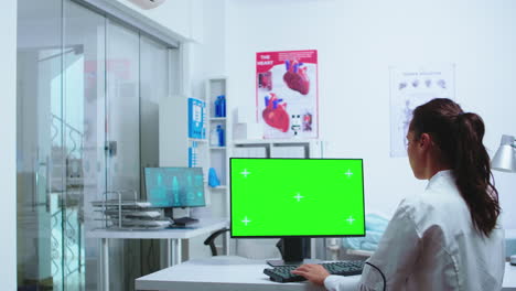 doctor typing on computer with copy space