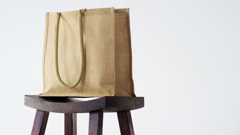 close-up of handbag on stool