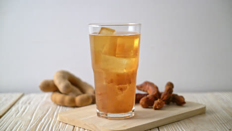 delicious sweet drink tamarind juice and ice cube - healthy drink style