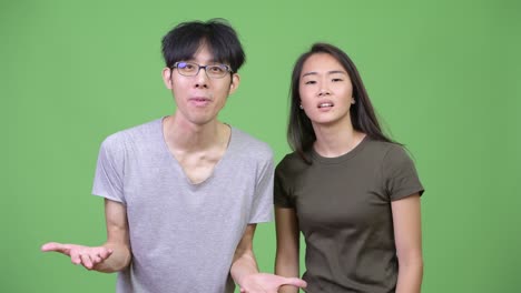 young asian couple getting angry together