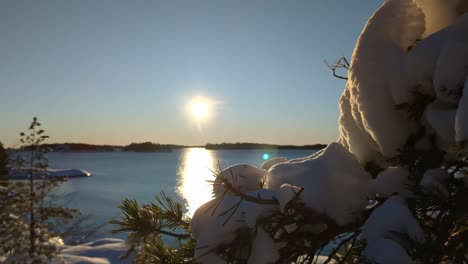 calm winter nature landscape with sea view and snow at sunset