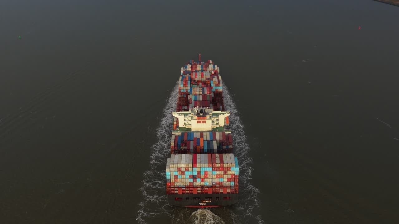 Commercial freight ship from above, maritime logistics in motion