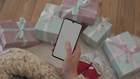 Hand-Using-A-White-Screen-Phone-Swiping-And-Touching-On-Mockup-Blank-Vertical-Display