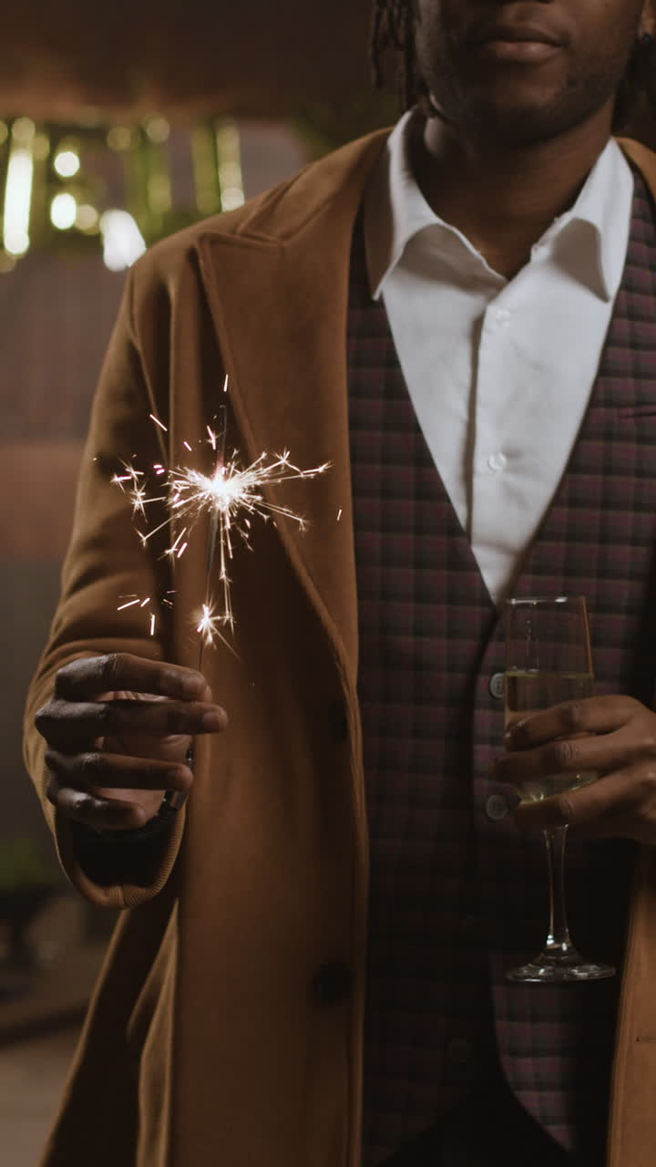 Man Celebrating with Sparkler and Champagne
