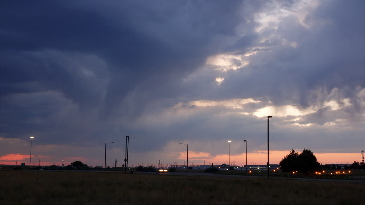 Storm clouds and downdrafts at sunset seen in time-lapse motion.