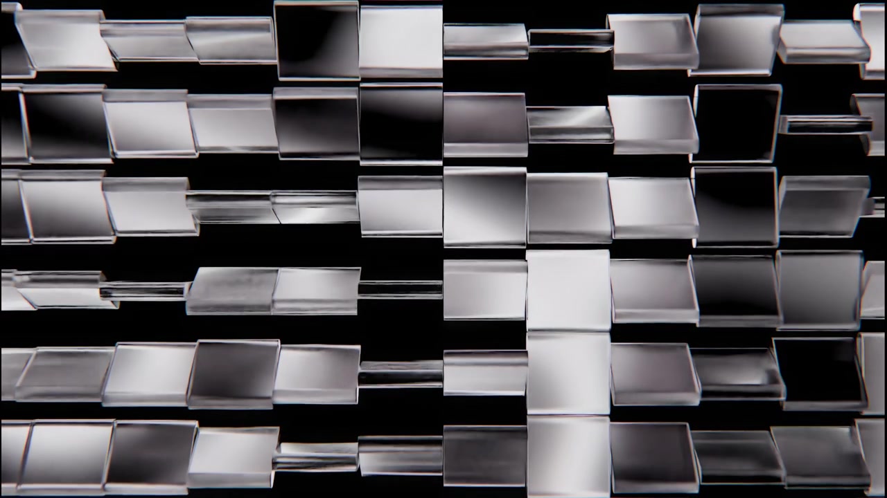 File ripetute di piastrelle quadrate in vetro trasparente o acrilico montate su sottili aste orizzontali si spostano lateralmente a passi discreti, creando alternativamente densi raggruppamenti, spazi aperti, riflessi luminosi e calma