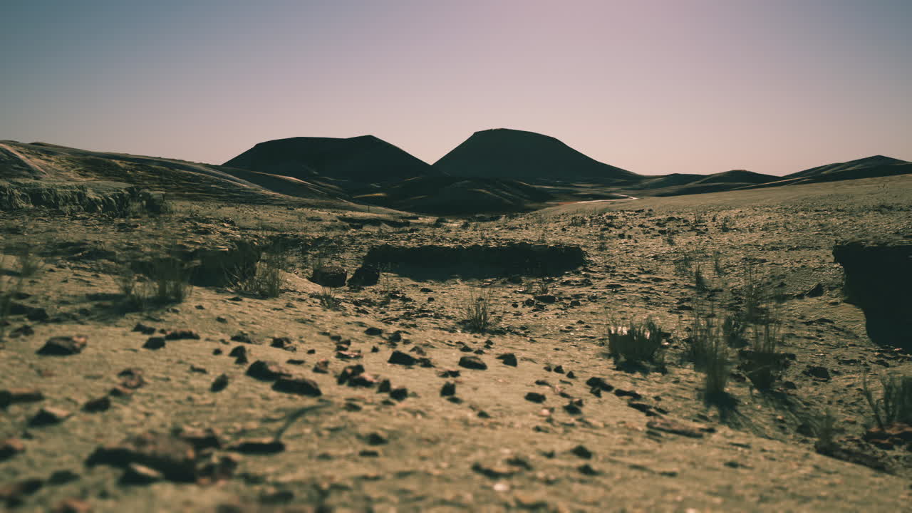 Vast arid landscape of mongolia showcasing unique geological formations at dusk