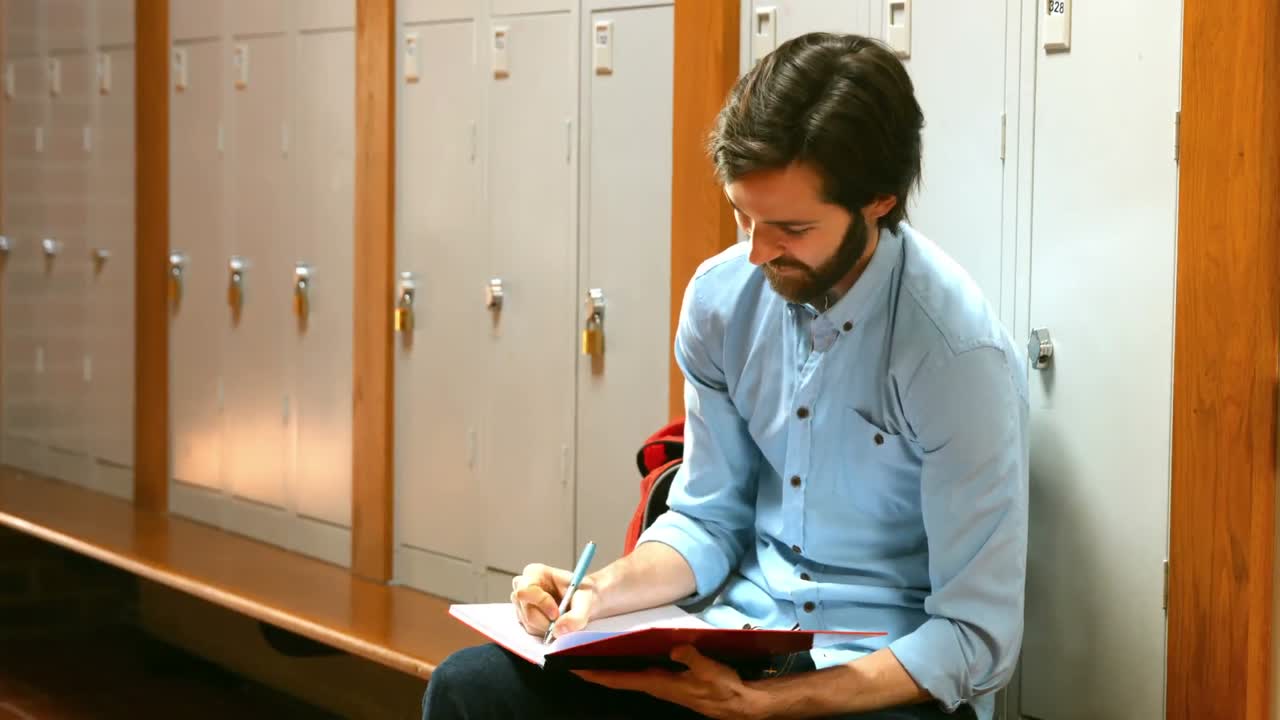 Hard working student writing down some notes