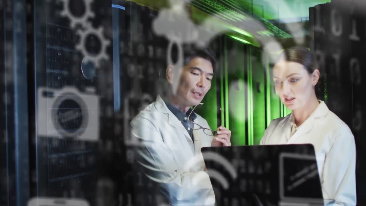 Animation of icons and data processing over diverse scientists using laptop