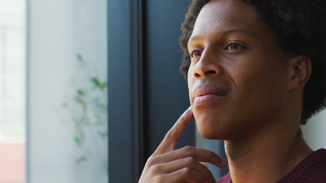 Happy african american man spending time alone at home