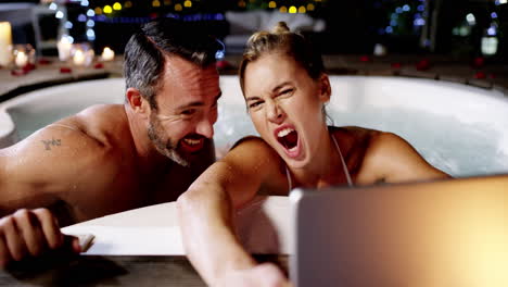 taking selfies in the hot tub