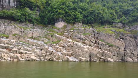 deep vertical canyon walls of the shennong xi stream, yangtze river tributary, as seen from the tourists cruise ship, china