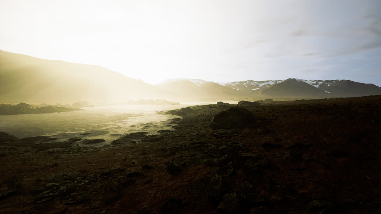 Beautiful natural landscape with mountains and mist during sunrise