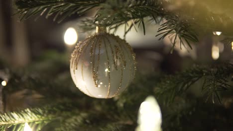 SLOW-MOTION:-decorating-christmas-tree-with-beautiful-Christmas-Bauble-and-candles
