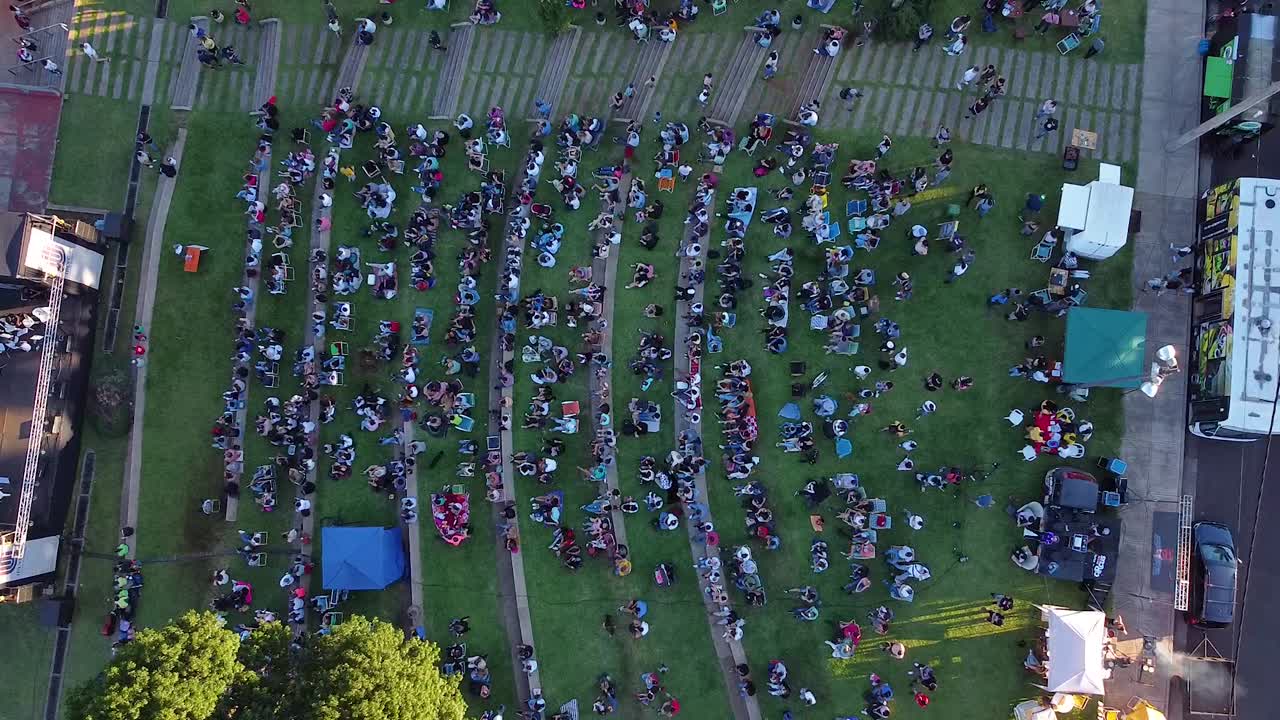 Bird's eye view of Posadas Anfiteatro El Brete festival area in Argentina with indie music concert visitors