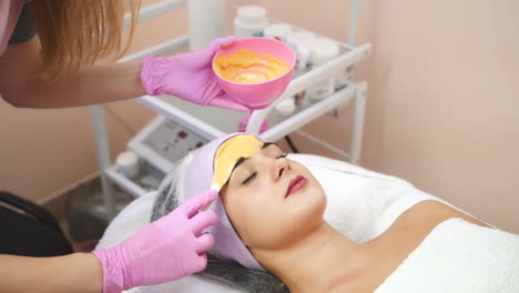 young woman gets beauty facial injections in salon. face aging, rejuvenation and hydration procedures. aesthetic cosmetology.