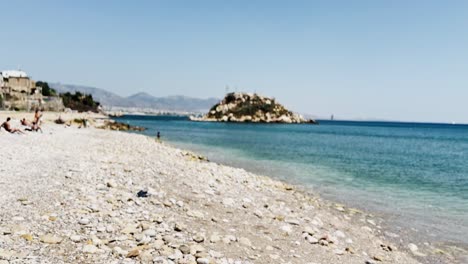 coastal scenery with people swimming