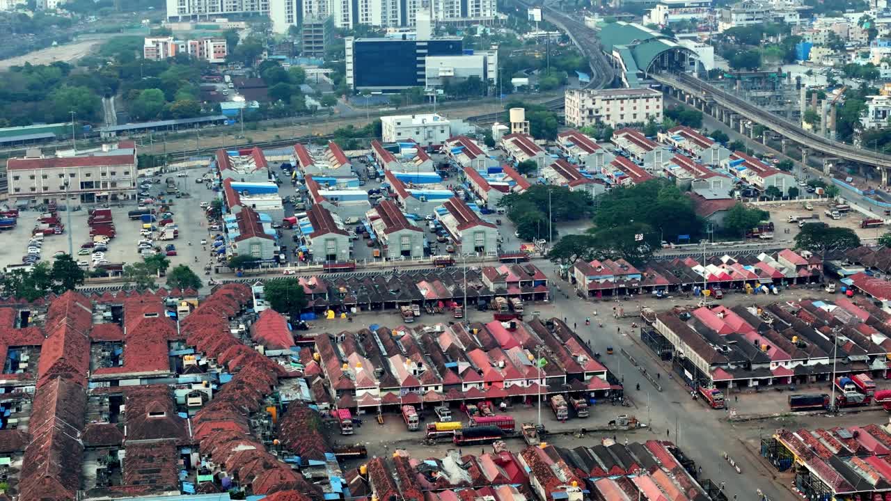 Early morning aerial footage of Koyembedu Market in Chennai City India. Chennai also is known as Madras is the capital of the Indian state of Tamil Nadu. wholesale shops