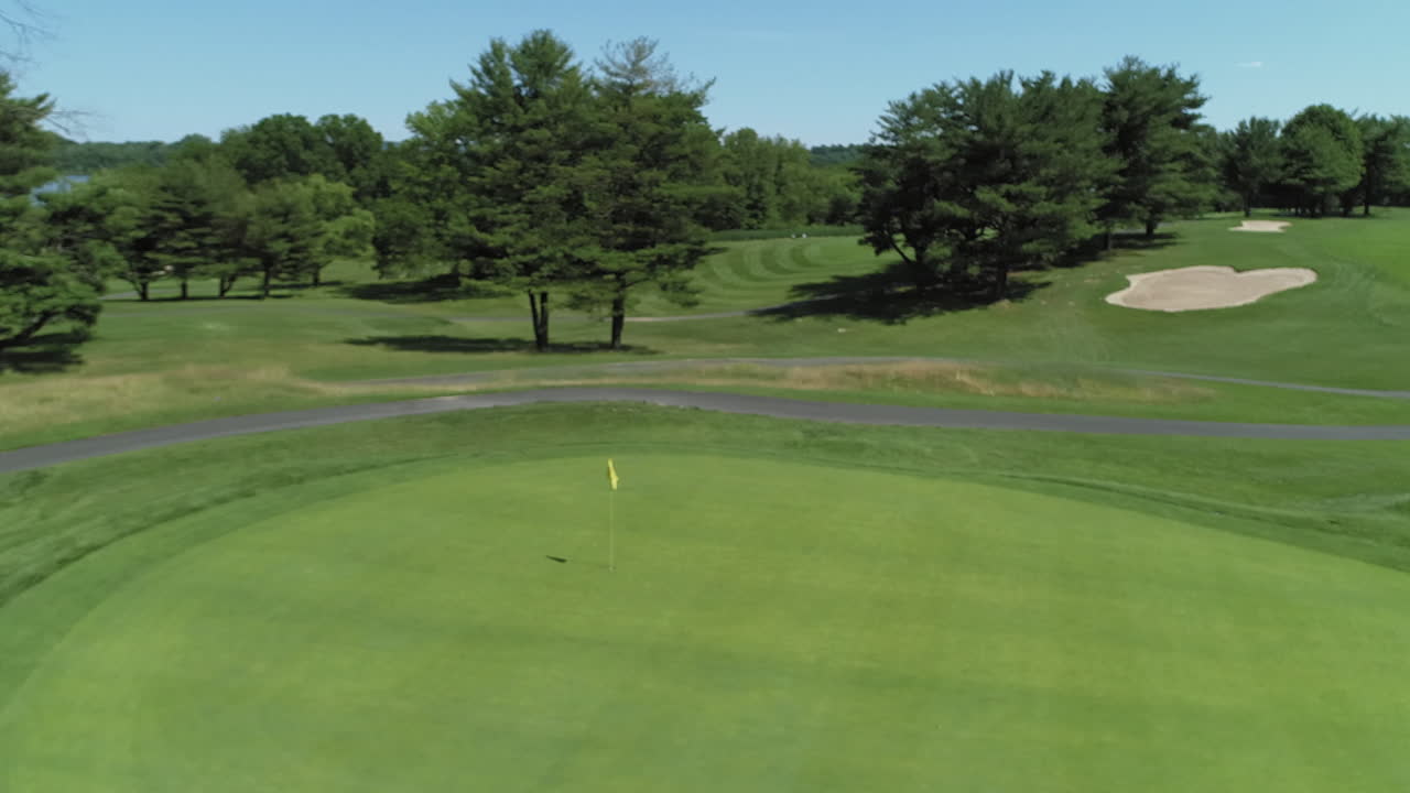 Aerial circle around green hole 11, River Vale Golf Course. Beautiful sunny day.