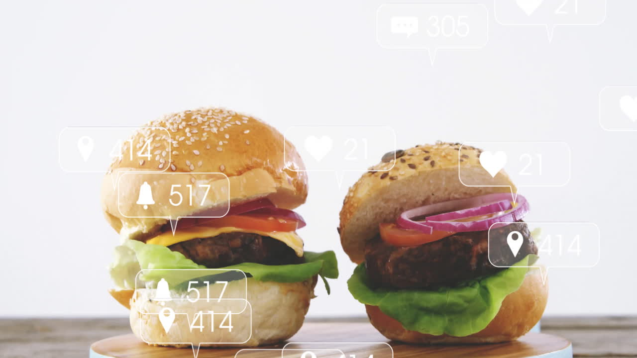 Animation of two burgers with social media notification icons in school setting